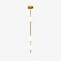 Three-globe Clérachic pendant on a pale backdrop, with a polished brass column and a domed brass ceiling plate.