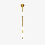 Three-globe Clérachic pendant on a pale backdrop, with a polished brass column and a domed brass ceiling plate.