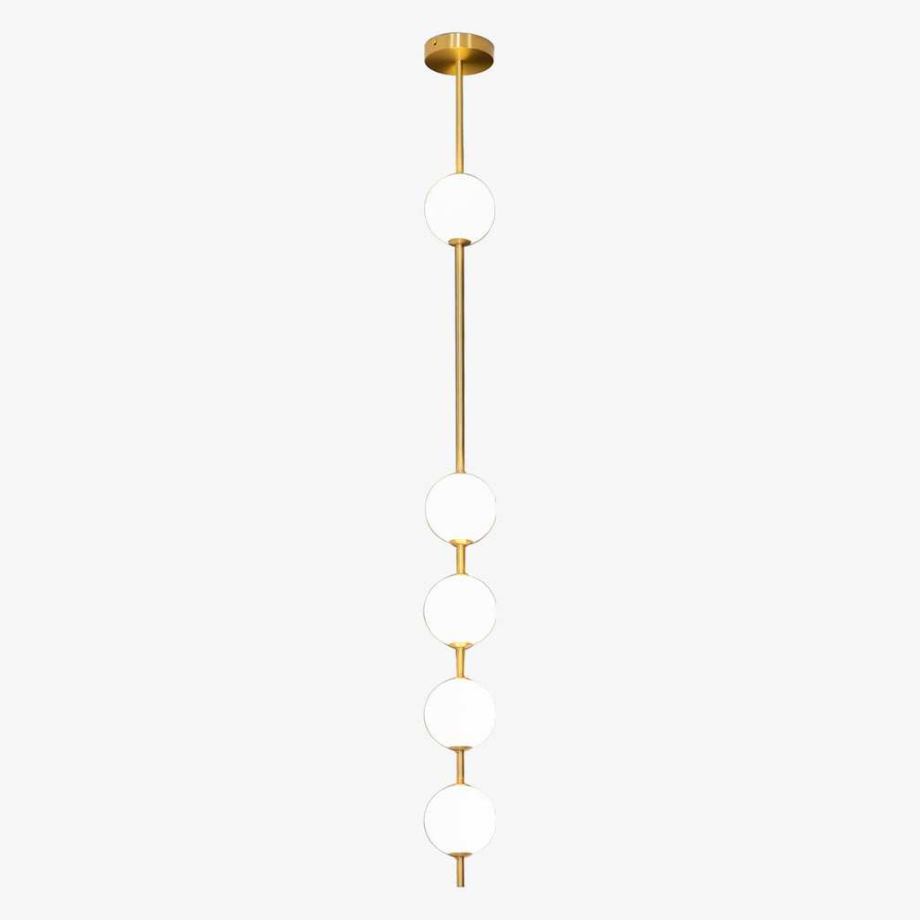 Five opal globes spaced along a brass column on a Clérachic pendant, with a gloss brass ceiling plate, on a pale grey backdrop.