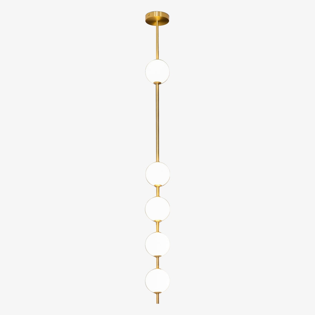 Five opal globes spaced along a brass column on a Clérachic pendant, with a gloss brass ceiling plate, on a pale grey backdrop.