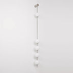The Clérachic Stacked Globe Wall Sconce in brushed nickel, unlit, five globes shown at a slight angle.