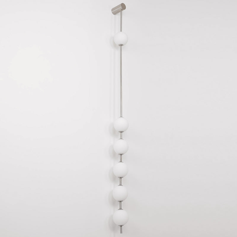 The Clérachic Stacked Globe Wall Sconce in brushed nickel, unlit, six globes shown full-length on white.