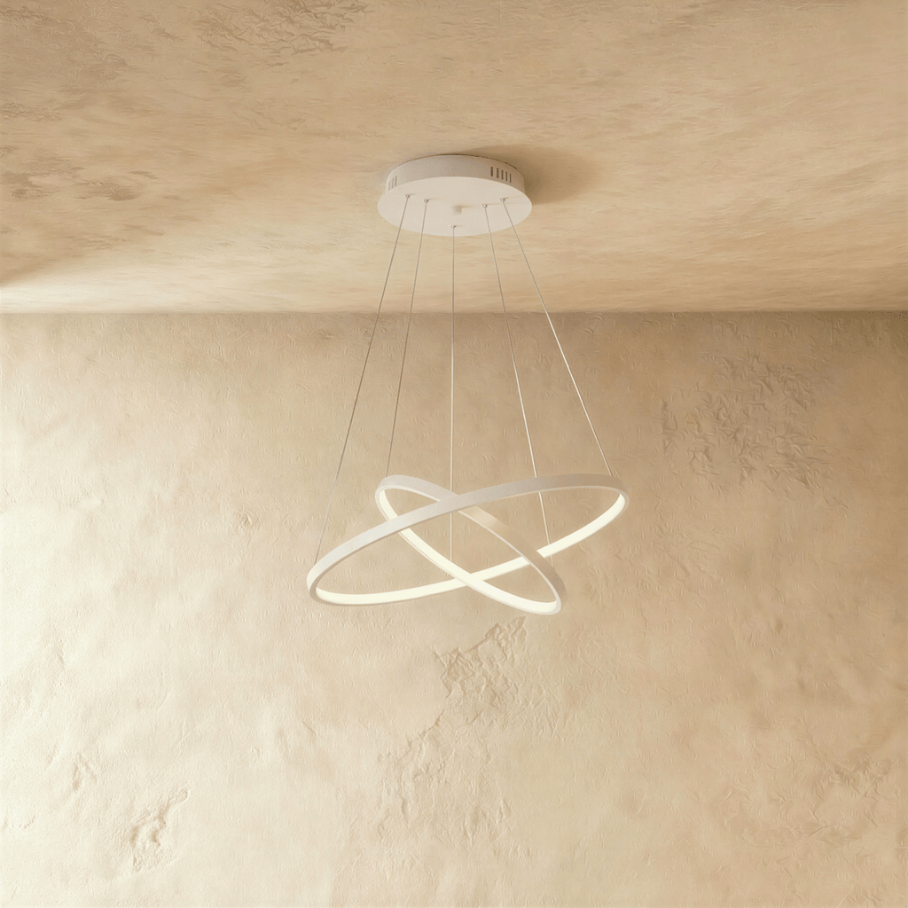 Clérachic's two-ring white pendant crosses its rings like an X, suspended on five fine cables overhead.