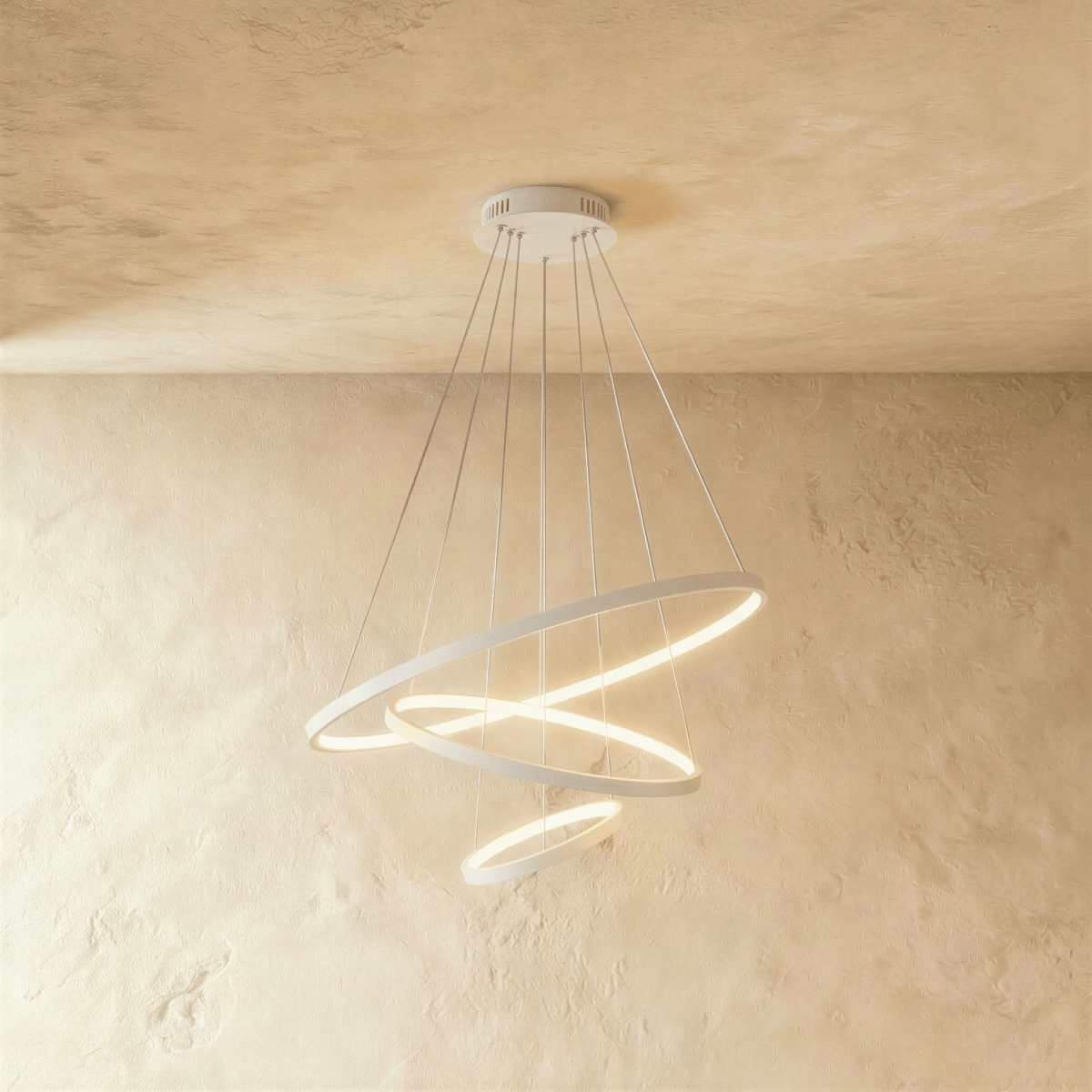 Three white rings cascade in a staggered spiral in this Clérachic chandelier, each glowing warm from below.