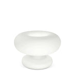 Frosted white Clérachic donut lamp on a white background, shown at a slight angle with its open ring top and rounded base.