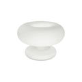 Matt white frosted glass Clérachic donut lamp on a white background, shot from slightly above with its open ring top in view.