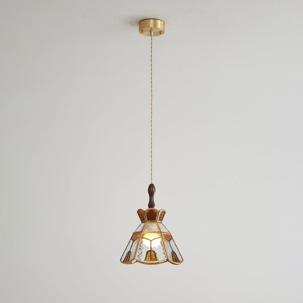 Small Clérachic stepped-crown pendant on a long cord from a brass ceiling canopy, shown against a pale wall.