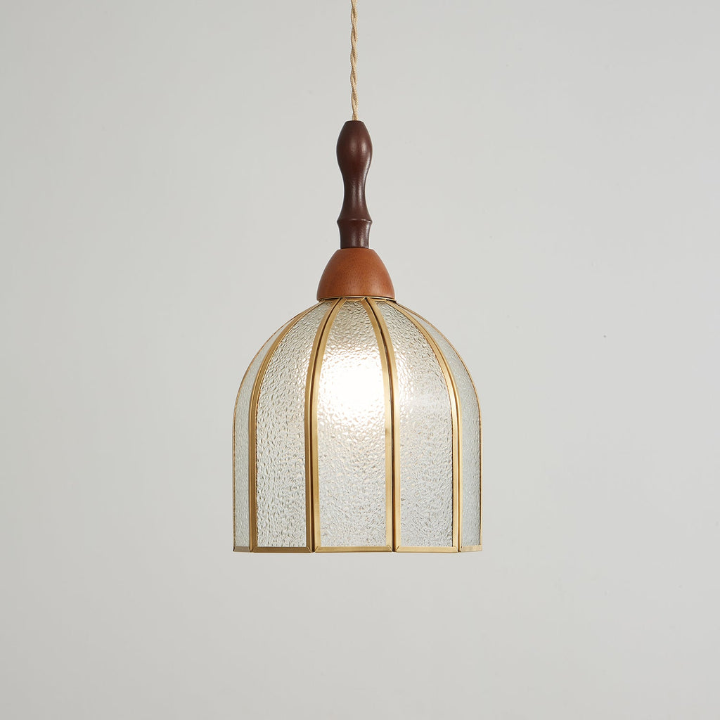 Larger view of the Clérachic domed pendant, its textured glass panels and brass ribs lit from within.