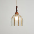 Larger view of the Clérachic domed pendant, its textured glass panels and brass ribs lit from within.