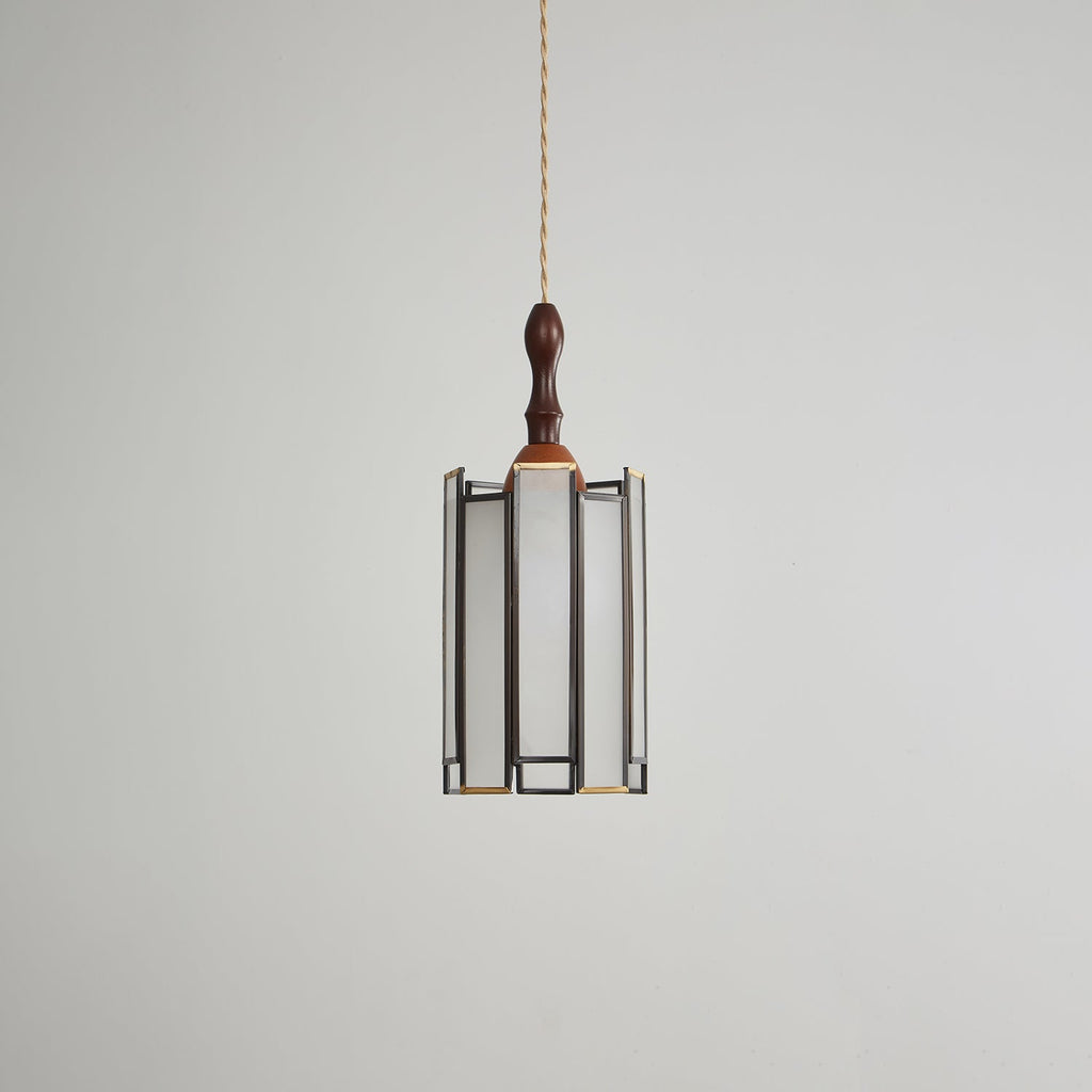 Unlit Clérachic pendant with a frosted glass shade in a slim dark frame, a wooden cap and a turned finial.
