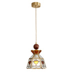 Clérachic heart-panel pendant on a long cord from a brass ceiling canopy, with amber hearts lit, on white.