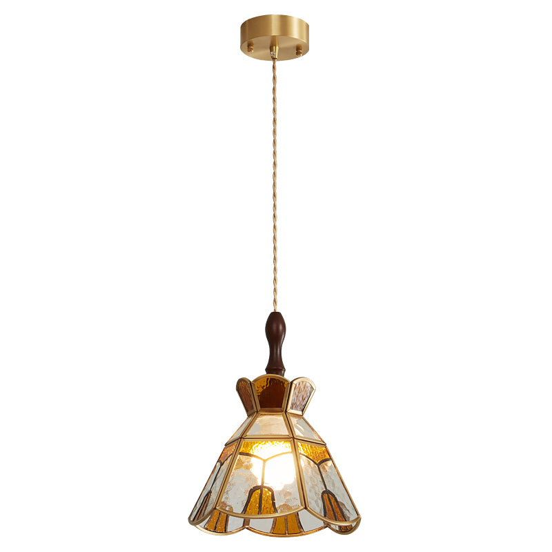 Clérachic stepped-crown pendant on a cord from a brass canopy, the clear and amber glass lit from inside, on white.