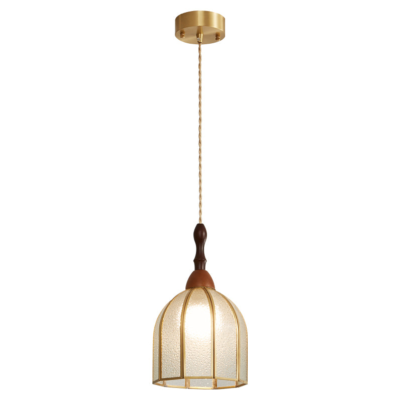 Clérachic domed pendant with brass ribs on a cord from a brass canopy, shown lit on a white backdrop.