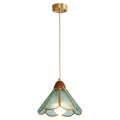 Teal Clérachic pendant on a short cord from a brass canopy, its rippled glass shade lit, on a white backdrop.