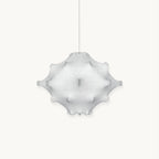 White Clérachic pendant with a star-like, dimpled shade on a thin cord, shown on a plain white backdrop.