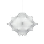 A smaller white Clérachic pendant with the same dimpled form, hung on a thin cord against white.