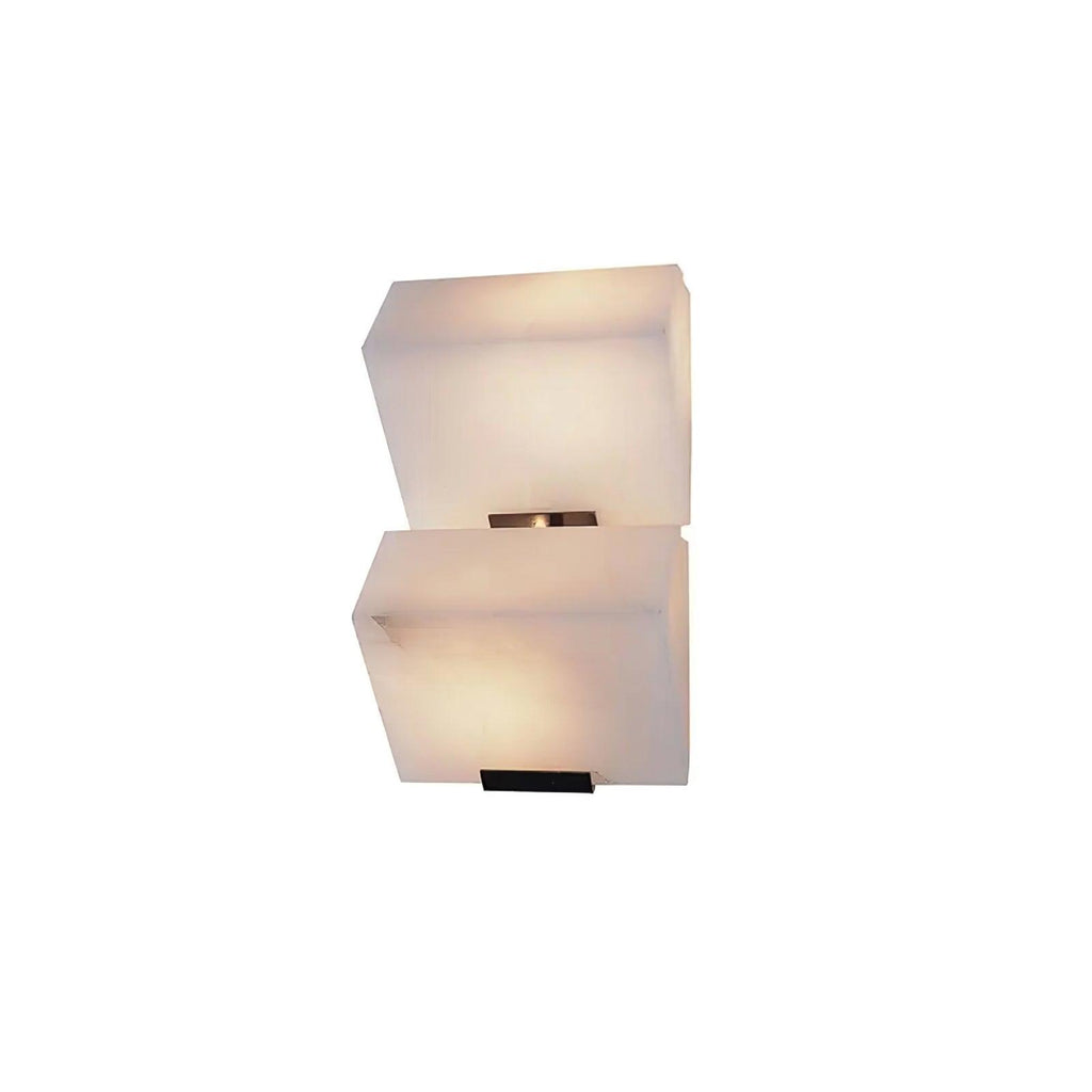 Cut-out view of a two-block Clérachic alabaster wall light, the stone softly lit and offset step by step.