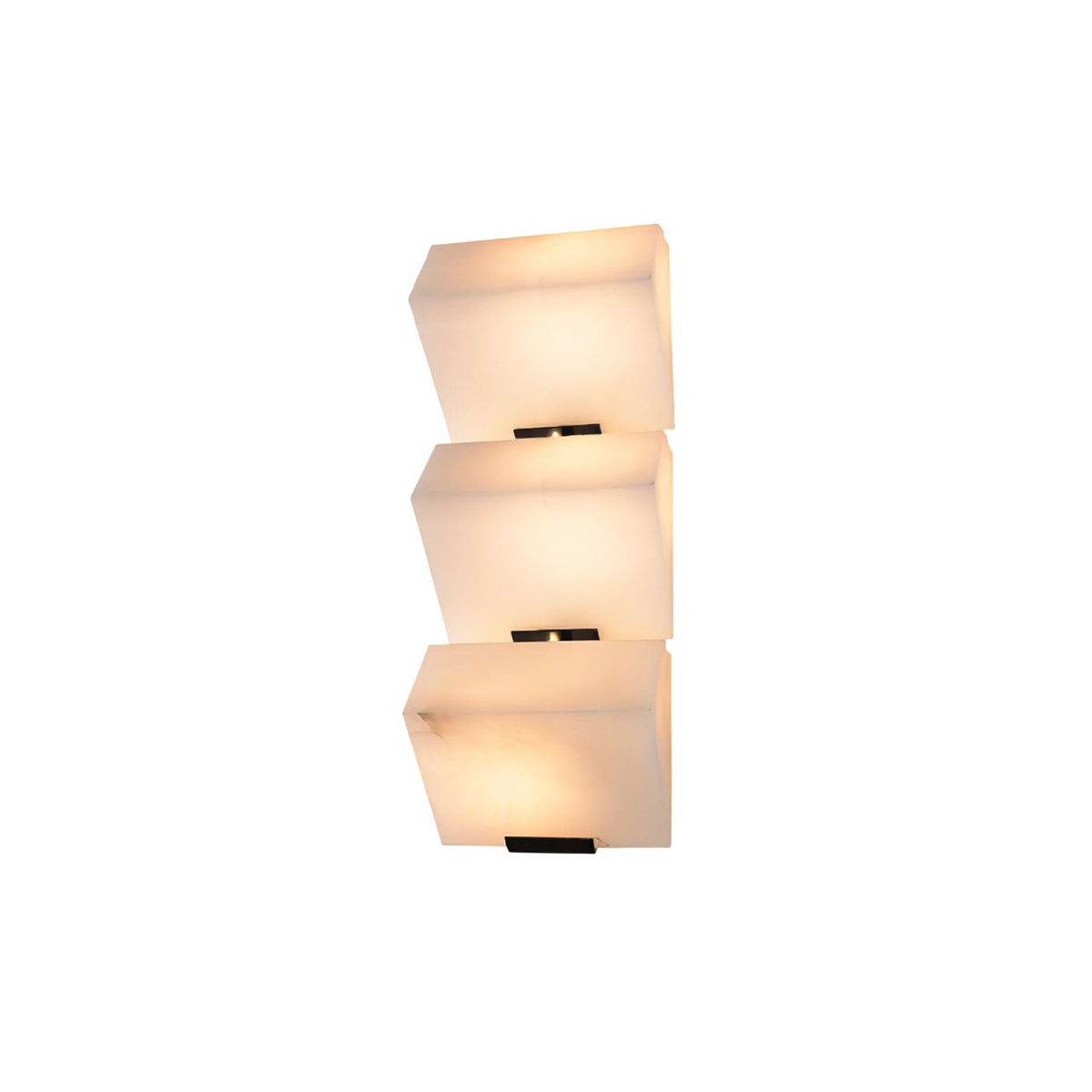 A three-block Clérachic alabaster wall light on white, the lowest block glowing warmest above a black wall plate.