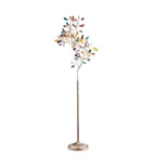 Clérachic agate floor lamp on a white backdrop, shown unlit with its stone slices and round fluted base.