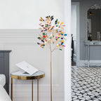 Clérachic agate floor lamp beside a gold side table with a laptop, in a hallway with a black and white tiled floor.