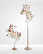 Tall Clérachic agate floor lamp beside a smaller table version, on a plain pale backdrop.