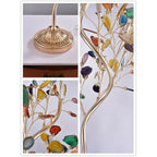 Collage of close views of this Clérachic floor lamp: the fluted gold base, the curved stem and the agate slices on thin branches.