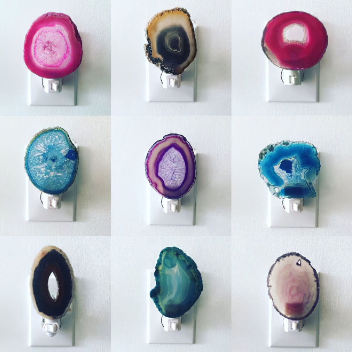 Small agate night lights in many colours, each fixed over a plug-in socket, shown as a reference for the stone used in this Clérachic floor lamp.