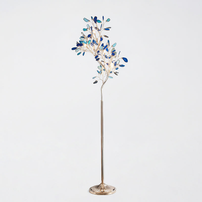 Clérachic agate floor lamp with blue and teal slices on thin gold branches, on a pale grey backdrop.
