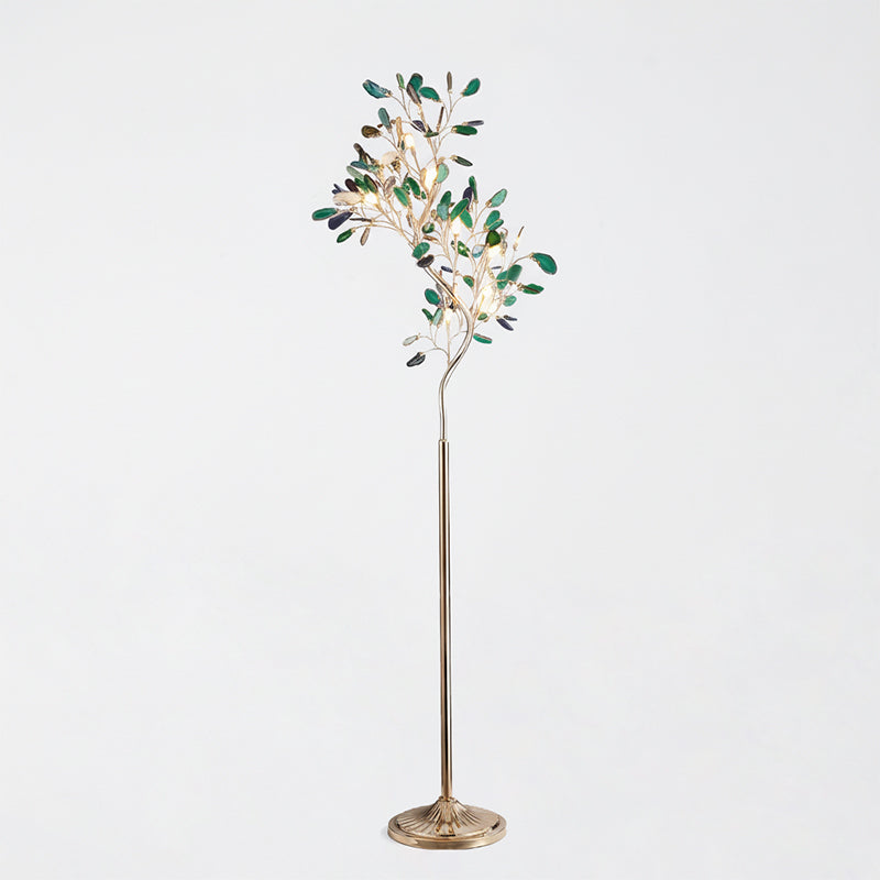 Clérachic agate floor lamp with green slices on thin gold branches, on a pale grey backdrop.