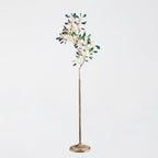 Clérachic agate floor lamp with green slices on thin gold branches, on a pale grey backdrop.