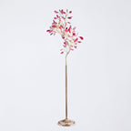 Clérachic agate floor lamp with pink and magenta slices on thin gold branches, on a pale grey backdrop.
