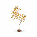 A Clérachic tree table lamp with yellow-gold agate leaves on a curved stem, shown unlit on a white backdrop.