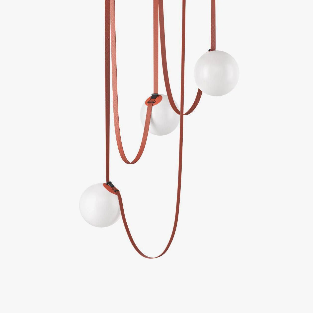Close-up of the Clérachic Strap-Hung Glass Globe Pendant Light's red canvas straps looping down to three staggered opal glass globes.