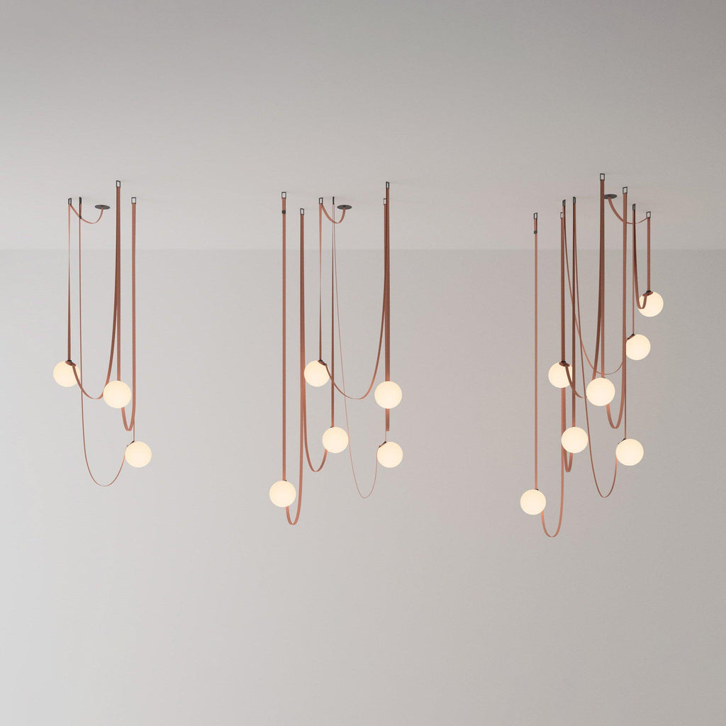 Three sizes of the Clérachic Strap-Hung Glass Globe Pendant Light shown side by side, comparing the three-, five- and nine-head clusters.