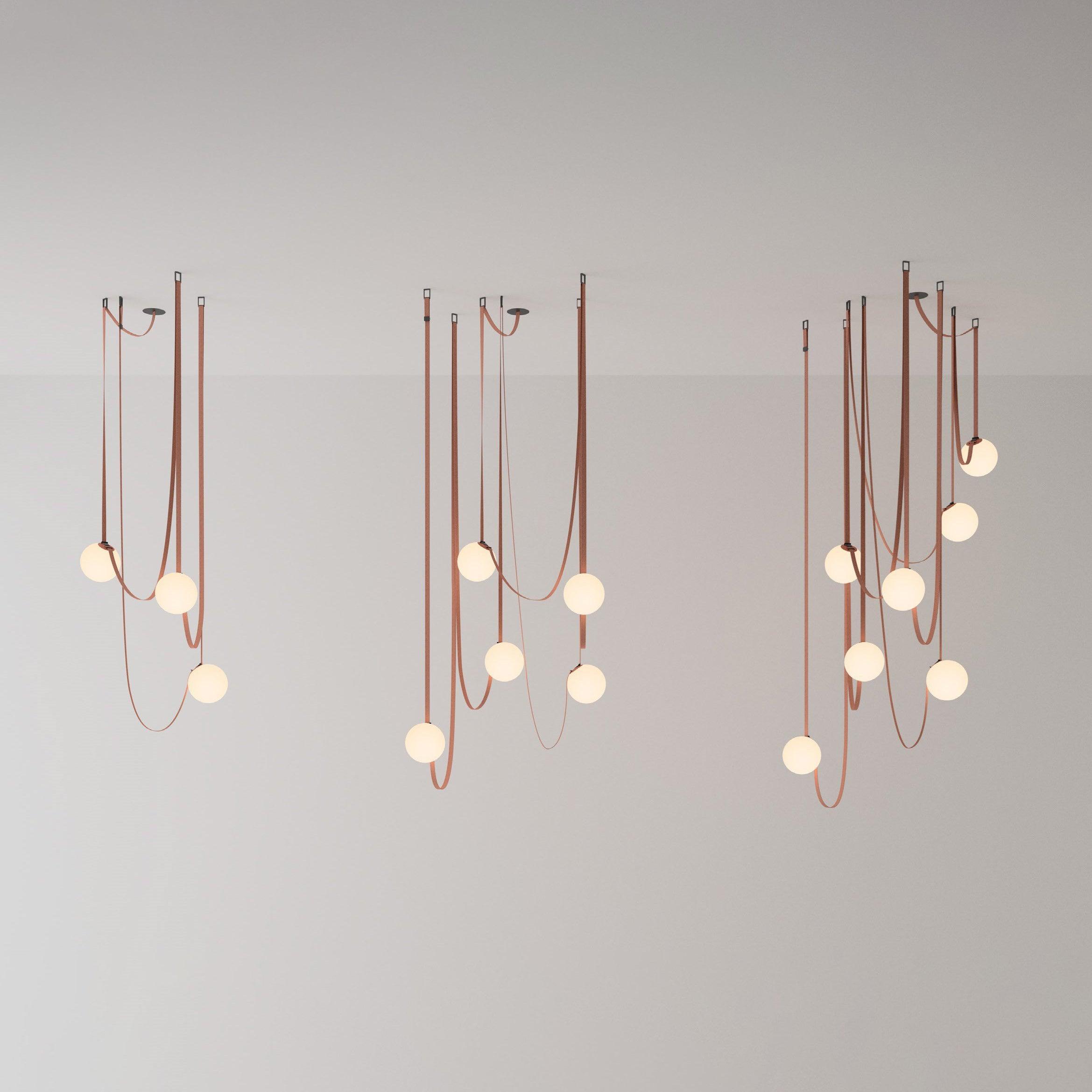 Three sizes of the Clérachic Strap-Hung Glass Globe Pendant Light shown side by side, comparing the three-, five- and nine-head clusters.