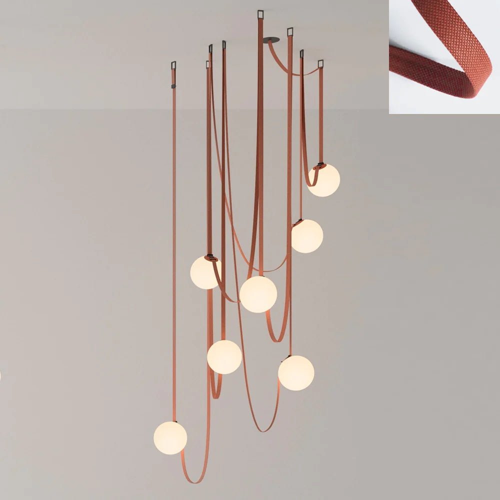 The Clérachic Strap-Hung Glass Globe Pendant Light's largest cluster in rust canvas, shown beside a swatch of the strap fabric.