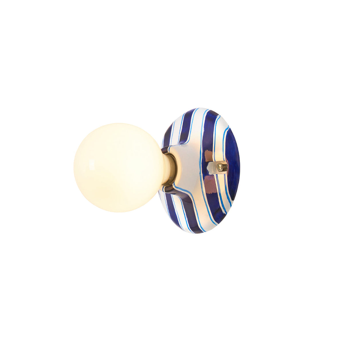 Blue and white striped ceramic backplate with a lit frosted globe, this Clérachic wall light on a plain white backdrop.