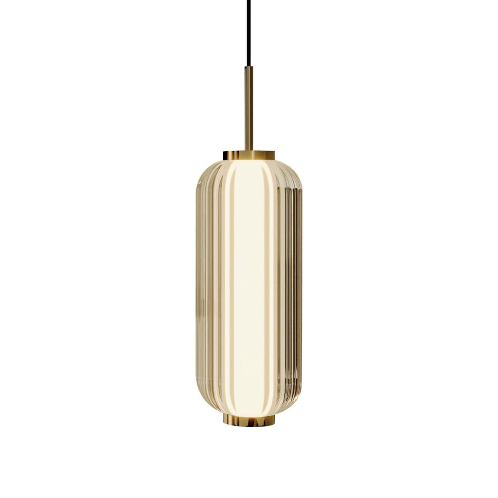 A larger ribbed glass cylinder Clérachic pendant in champagne-tinted glass, with a gold stem and collars, on a white backdrop.