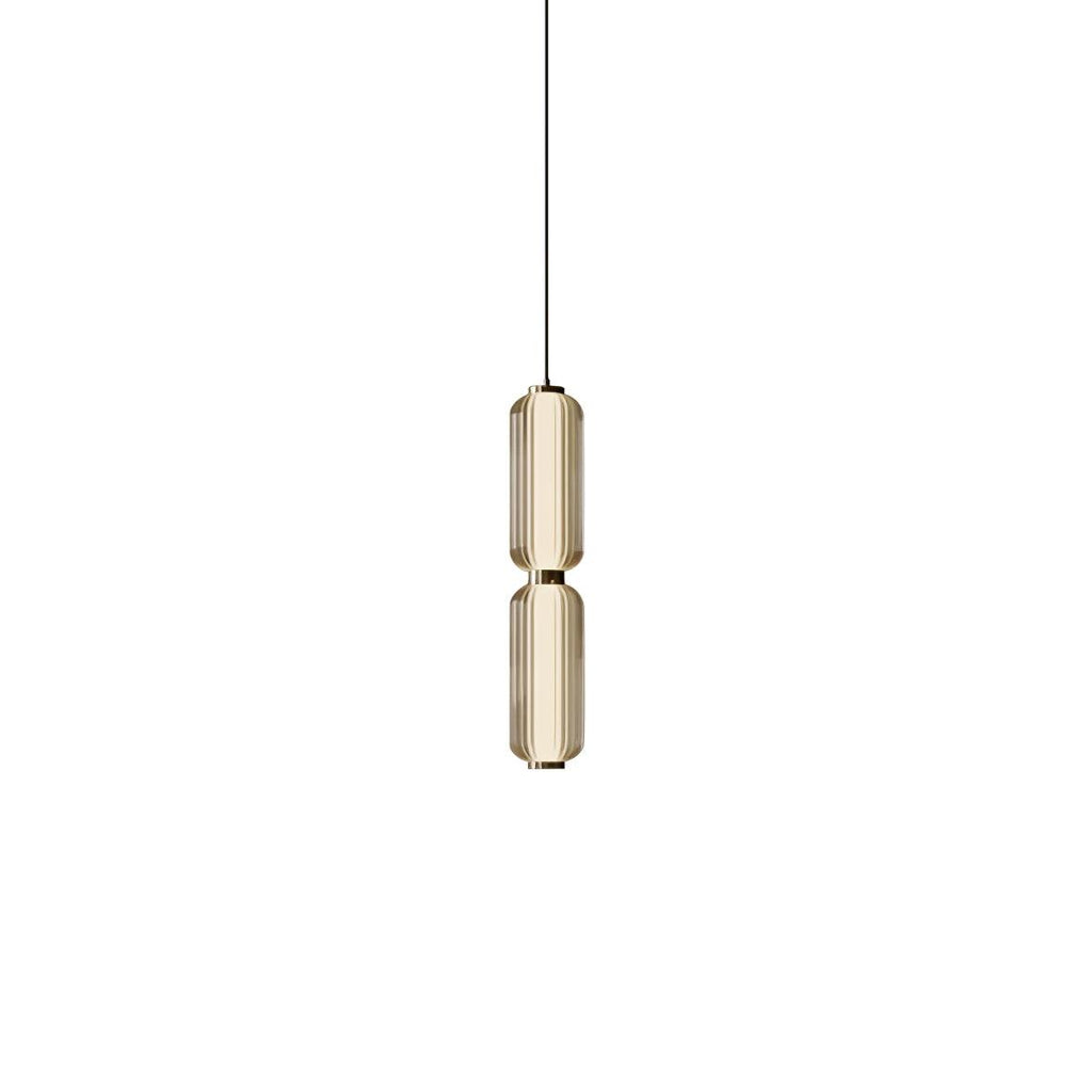 A slim two-tier Clérachic pendant in champagne-tinted ribbed glass with gold collars, on a plain white backdrop.