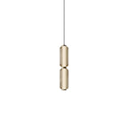 A slim two-tier Clérachic pendant in champagne-tinted ribbed glass with gold collars, on a plain white backdrop.