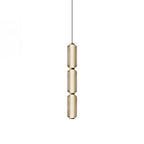 A slim three-tier Clérachic pendant in champagne-tinted ribbed glass with gold collars and a thin black cord, on white.