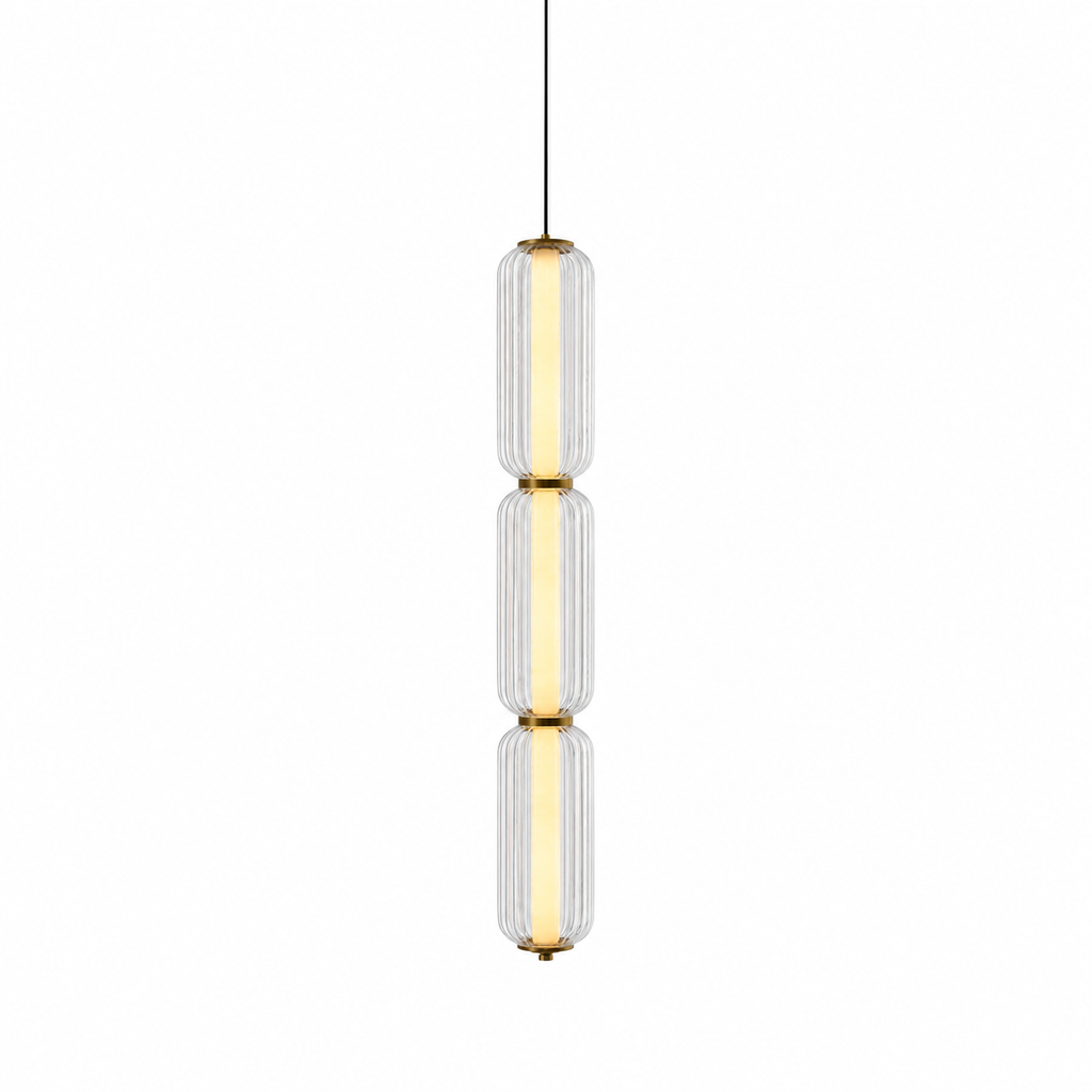 A slim three-tier Clérachic pendant in clear ribbed glass with gold collars, lit with a warm inner tube on white.