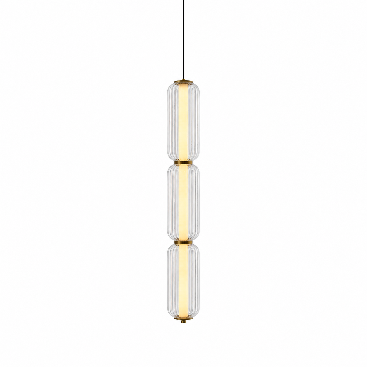 A slim three-tier Clérachic pendant in clear ribbed glass with gold collars, lit with a warm inner tube on white.