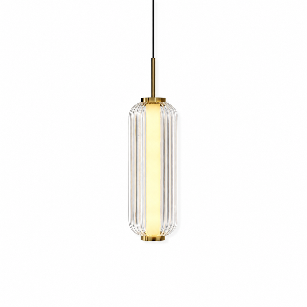 A ribbed clear glass cylinder Clérachic pendant with a lit inner tube, a gold stem and gold caps, on a white backdrop.