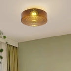 Clérachic Sunburst Amber Glass Flush Mount Ceiling Light lighting a corner where a sage-green wall meets olive curtains.