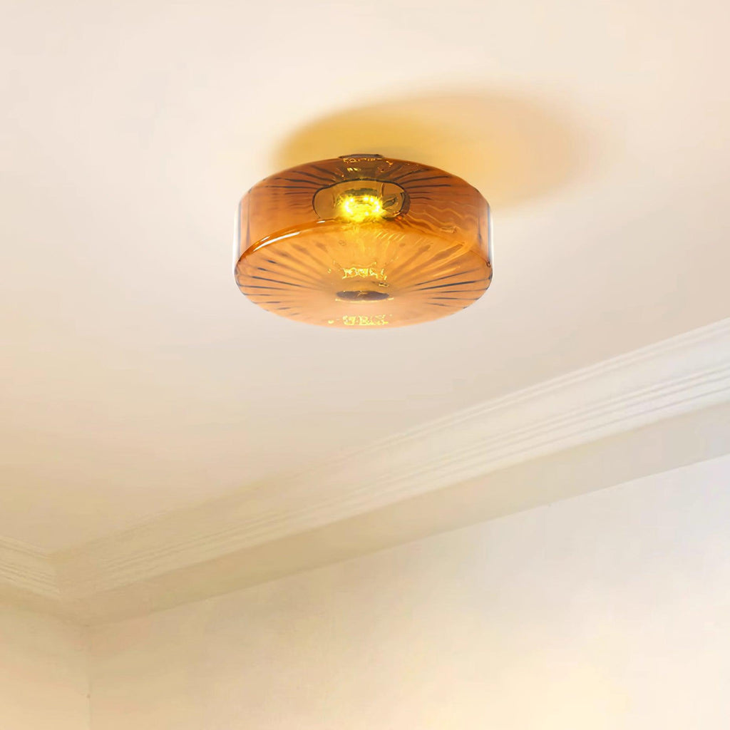 Clérachic Sunburst Amber Glass Flush Mount Ceiling Light warming a bare ceiling above deep cornice moulding in a quiet corner.