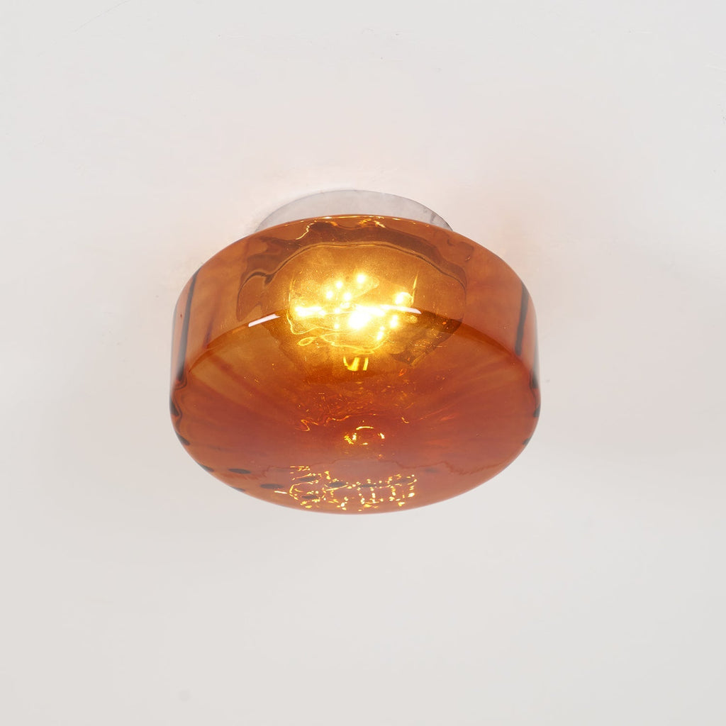 Clérachic Sunburst Amber Glass Flush Mount Ceiling Light seen straight on from below, the LED reading as a bright pool inside the glass.