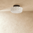 Clérachic white flush ceiling light unlit, fluted glass shade with raised beads and an embossed sunburst base, black canopy.