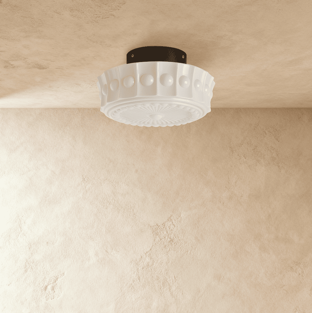 Clérachic white flush ceiling light unlit, fluted glass shade with raised beads and an embossed sunburst base, black canopy.