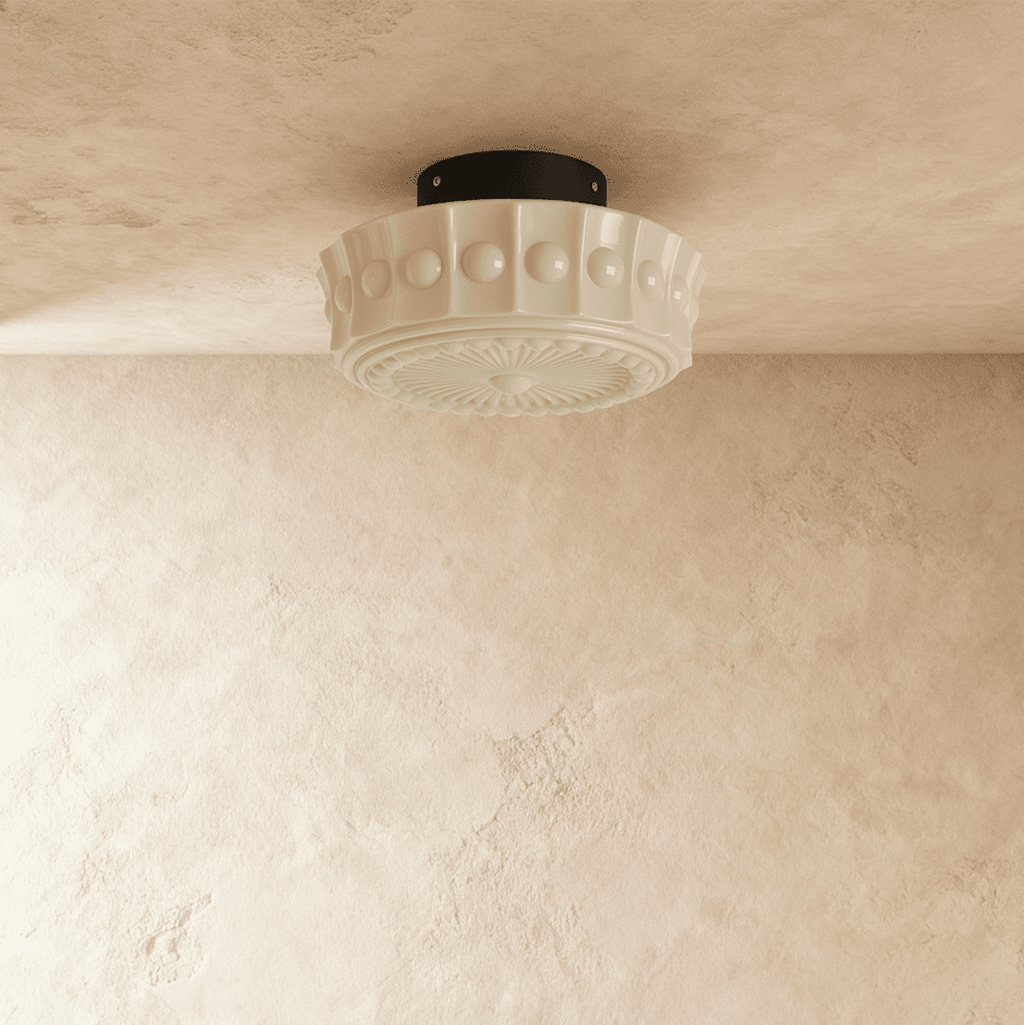 Clérachic cream flush ceiling light unlit, a fluted glass shade with raised beads and a sunburst base on a black canopy.